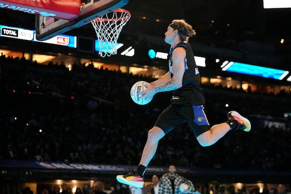 Osceola Magic's Mac McClung dunks during the slam dunk competition at the NBA basketball All-Star weekend, Saturday, Feb. 17, 2024, in Indianapolis. (AP Photo/Darron Cummings)