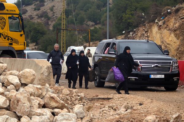 Displaced residents return from Syria at the Masnaa border crossing, eastern Lebanon, following a ceasefire between Israel and Hezbollah on Wednesday, Nov. 27, 2024. (AP Photo/Hassan Ammar)