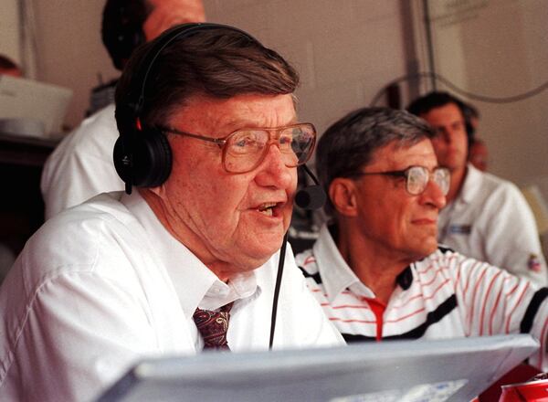 Larry Munson in a crowded press box in 1996.