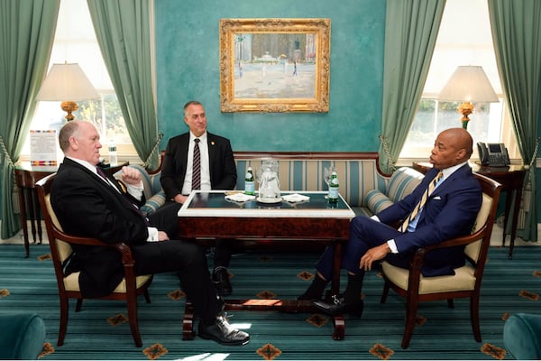 This image provided by the Office of the New York Mayor shows New York Mayor Eric Adams, right, meeting with President-elect Donald Trump's incoming "border czar" Tom Homan, left, and President Joe Biden's Department of Homeland Security Official Kenneth Genalo at Gracie Mansion, in New York, Thursday, Dec. 12, 2024. (Mayoral Photography Office/Michael Appleton via AP)