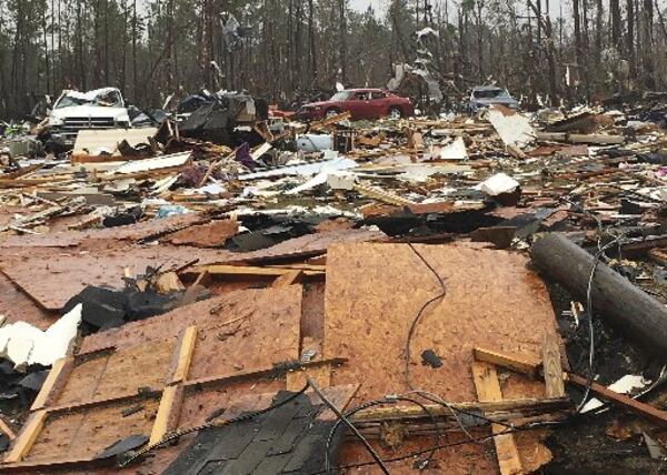 Mobile homes and vehicles lie destroyed Monday in Cook County. (Credit: Associated Press)