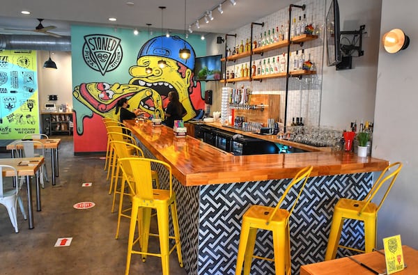 Stoned Pizza Kitchen in Stone Mountain Village is an all-American style pizzeria with a full bar. (Chris Hunt for The Atlanta Journal-Constitution)