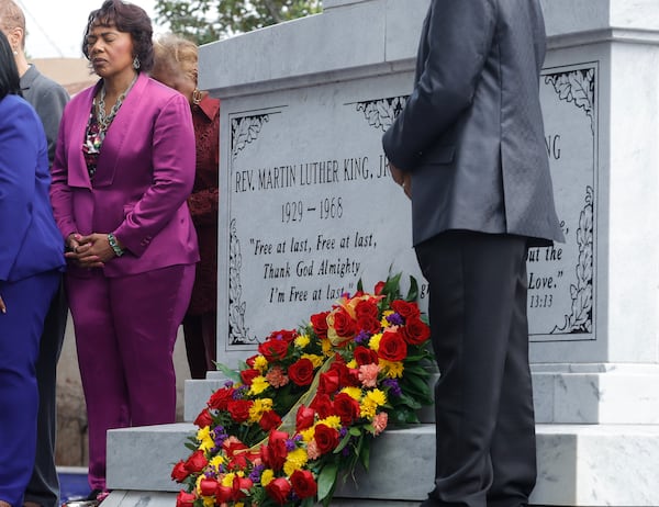 Dr. Bernice King, daughter of the Rev. Martin Luther King Jr. bows her head in prayer during a wreath-laying ceremony on the 55th anniversary of his assassination at the King Center on Monday, April 4, 2023. (Natrice Miller/natrice.miller@ajc.com)