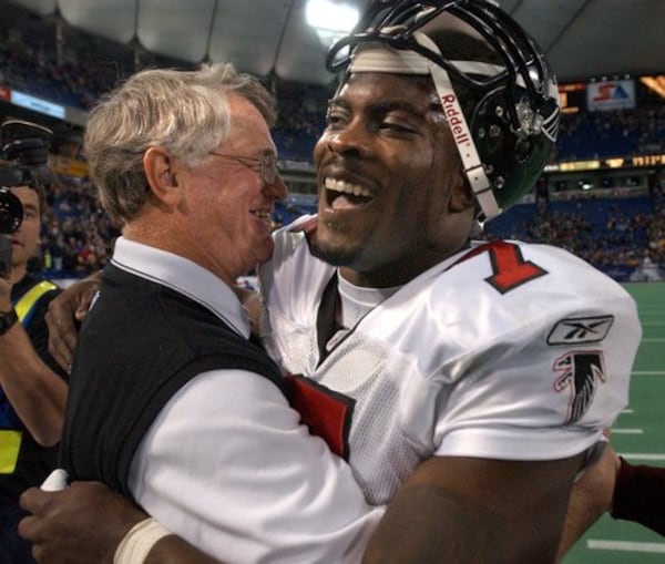 Dan Reeves (left) and Michael Vick celebrate in 2002.