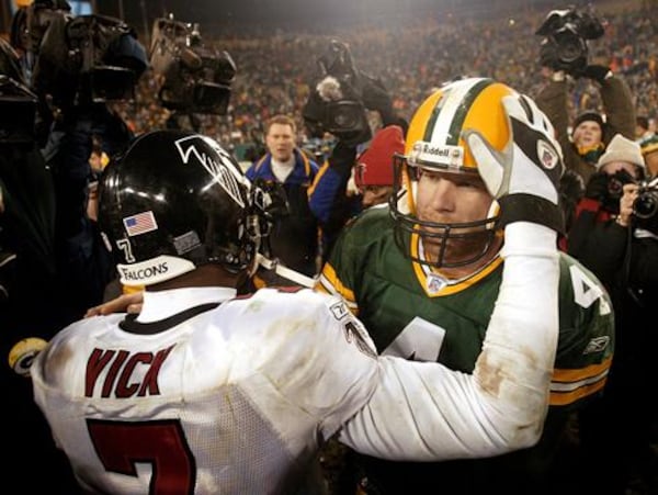 Falcons quarterback Michael Vick and Packers quarterback Brett Favre after Atlanta's 2003 wildcard playoff win in Green Bay.