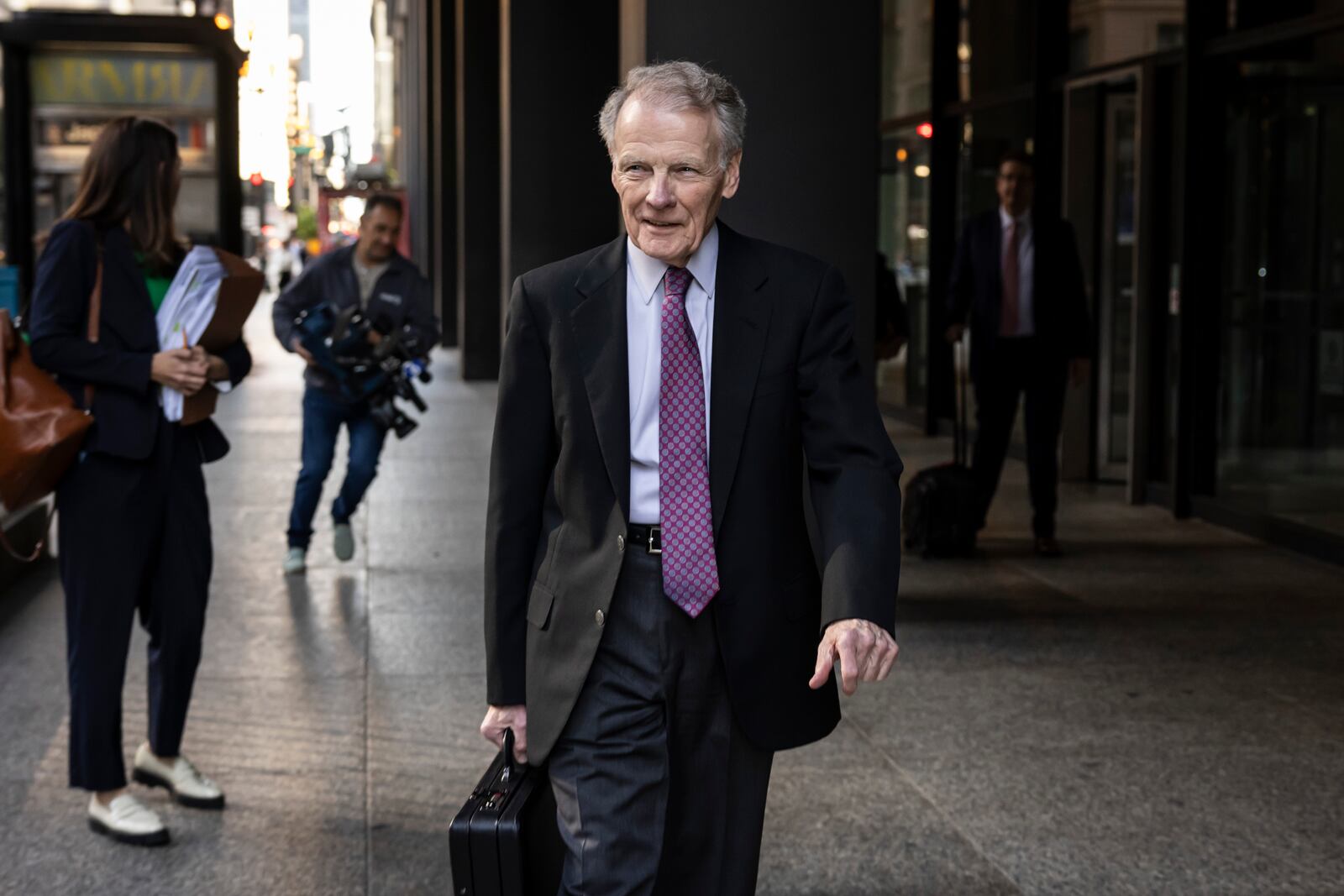 Illinois' former House Speaker Michael Madigan, charged in a multimillion-dollar racketeering and bribery scheme that included the state’s largest utility, ComEd, walks out of the Dirksen Federal Courthouse, Wednesday, Oct. 9, 2024 in Chicago. (Ashlee Rezin/Chicago Sun-Times via AP)