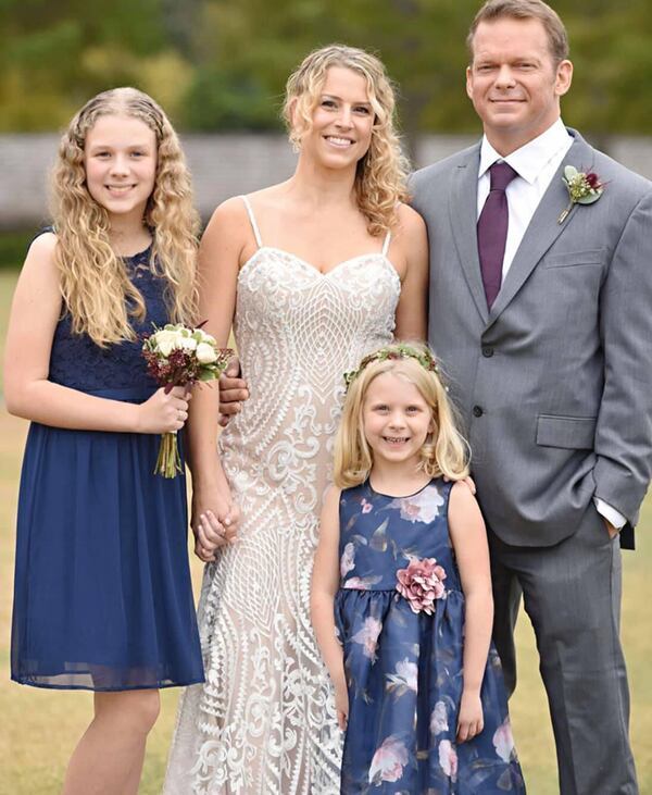 Susan and Lance Ellis, with Taylor, 13, and Molly, 7.