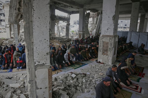 Palestinians pray during the first Friday prayers of the Muslim holy month of Ramadan at the Imam Shafi'i Mosque, damaged by Israeli army strikes, in the Zeitoun neighborhood in Gaza City, Friday March 7, 2025.(AP Photo/(AP Photo/Jehad Alshrafi)