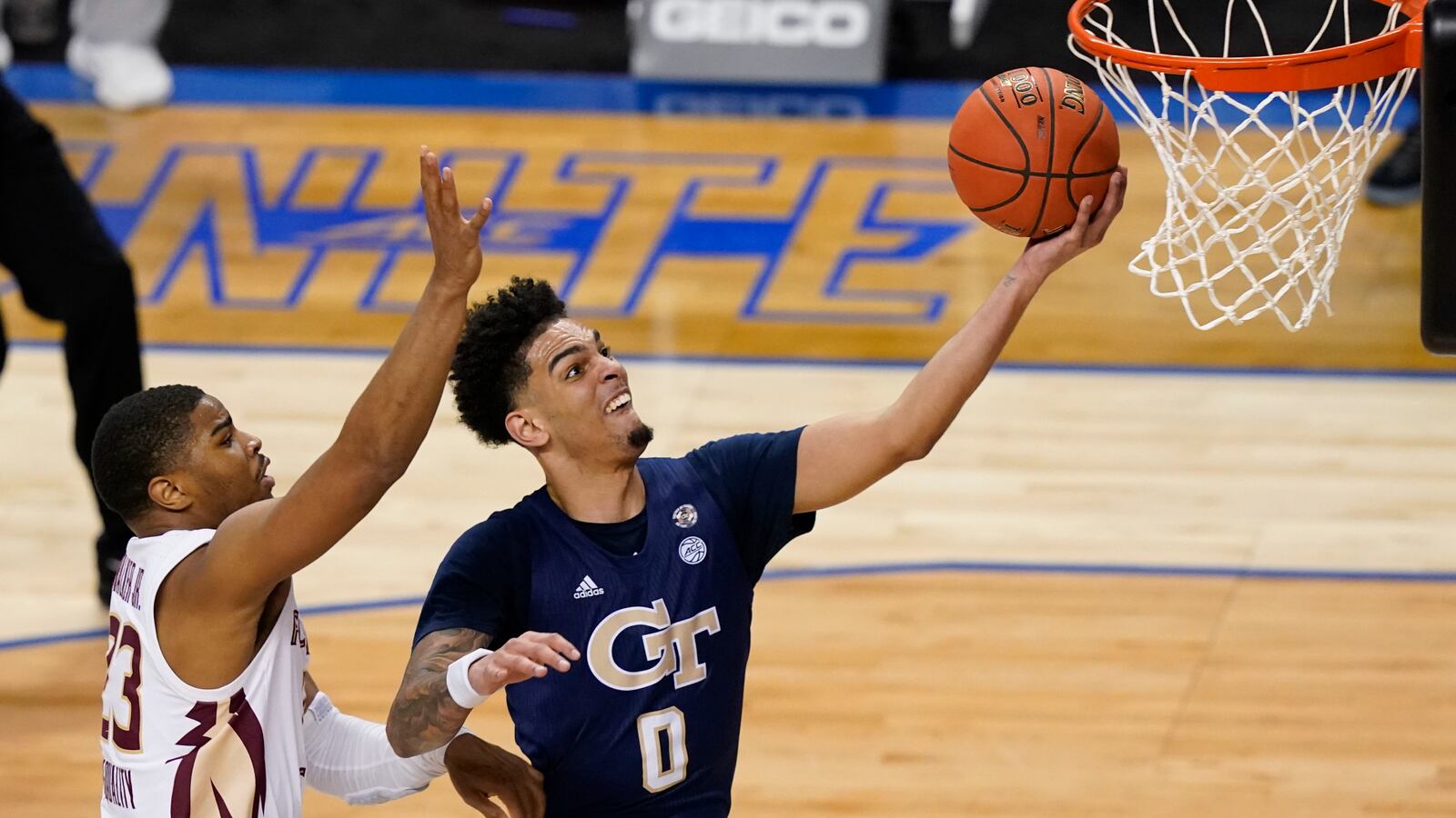 Georgia Tech guard Michael Devoe drives to the basket for two points during Saturday's ACC championship game against Florida State.