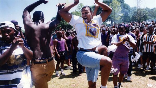 College students dance in Piedmont Park during Freaknik on April 23, 1994.