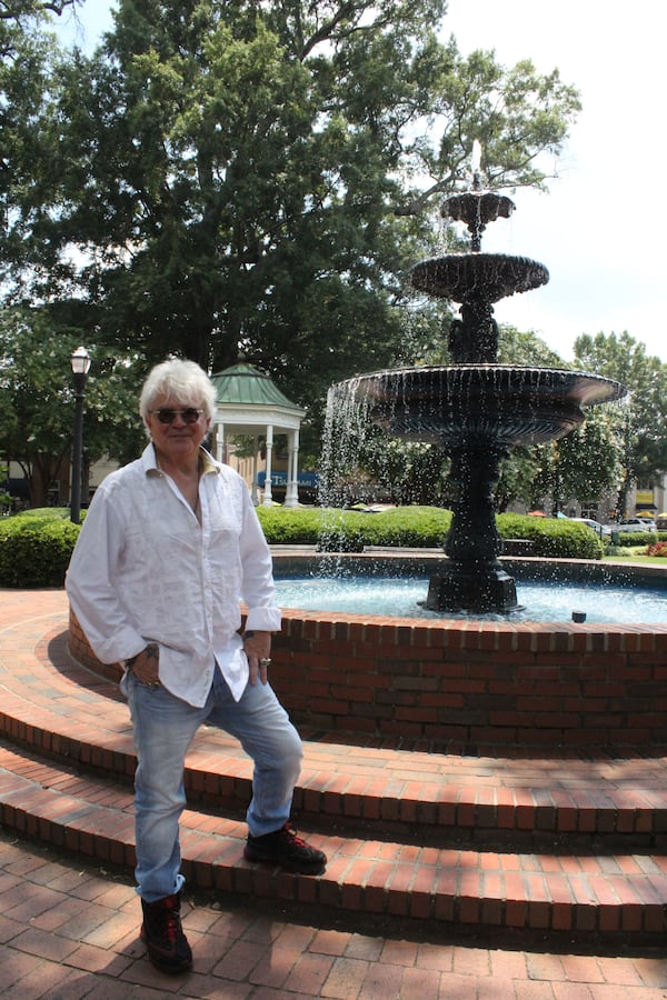 There is a reason Air Supply singer Russell Hitchcock is standing in Marietta Square... Photo: Melissa Ruggieri/AJC.