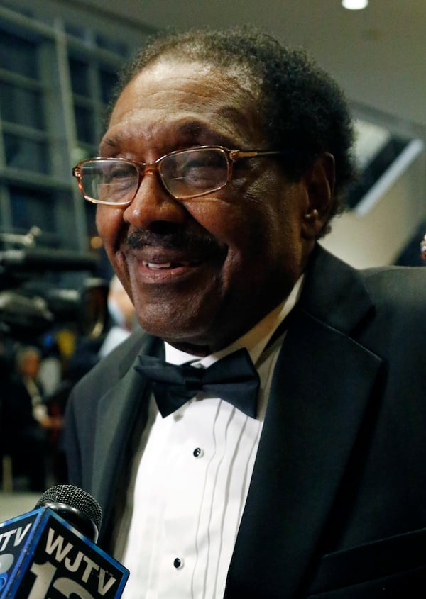 FILE - Former state Rep. Robert Clark speaks with reporters prior to the Friends of Mississippi Civil Rights gala Friday, Feb. 23, 2018 in Jackson, Miss., where he was one of five civil rights veterans honored. (AP Photo/Rogelio V. Solis, File)