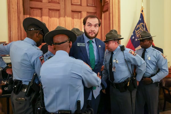 State Sen. Colton Moore, a Republican from Trenton, is detained by the  Georgia State Patrol as he attempted to enter the state House of Representatives in Atlanta on Thursday.