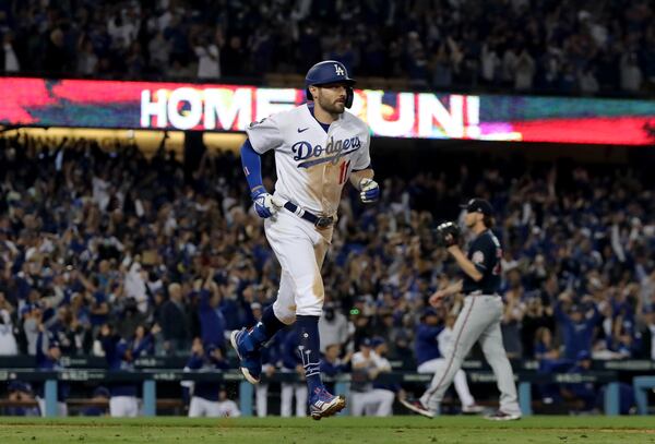 Los Angeles Dodgers left fielder AJ Pollock reacts after hitting a three-run home run off of Atlanta Braves relief pitcher Jacob Webb. Curtis Compton / curtis.compton@ajc.com 