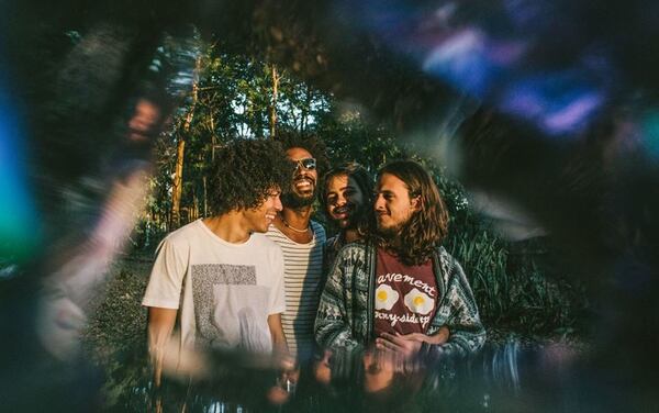 Band members of Boogarins pose for a psychadelic photo