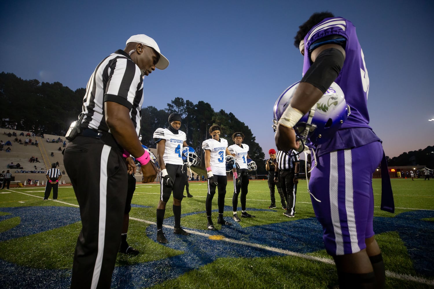 The referee tosses a coin before a GHSA high school football game between Stephenson High School and Miller Grove High School at James R. Hallford Stadium in Clarkston, GA., on Friday, Oct. 8, 2021. (Photo/Jenn Finch)