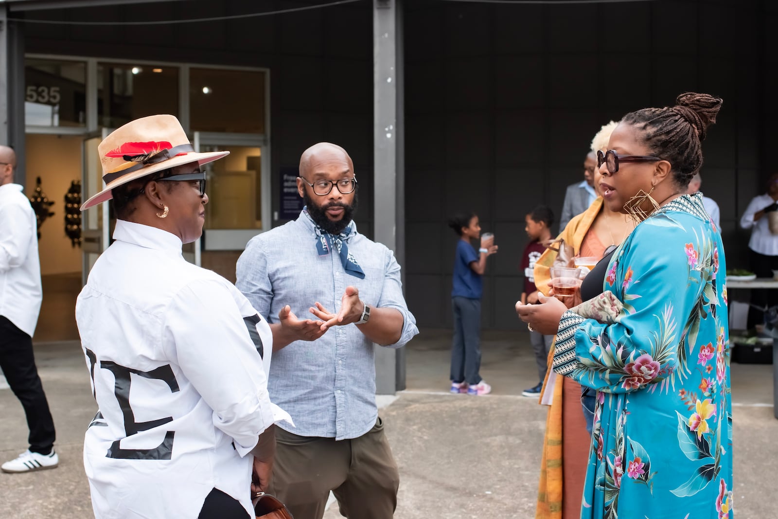 Floyd Hall, executive director of Atlanta Contemporary, speaks to guests of a supper club event organized by Nasim and Clint Fluker for members of The Tenth.