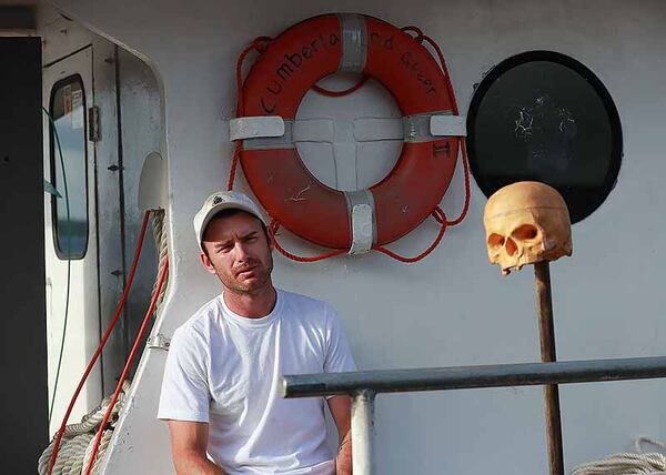  Captain Jeffery Williams works on the Cumberland Queen II at the dock in St. Marys on Tuesday while waiting out Hurricane Dorian. He might move the boat futher up the St. Marys River for safety to ride out the storm on board. The ferry serves nearby Cumberland Island. A skull the crew calls “Terry The Terrifier” serves as the ferry’s good luck charm.   Curtis Compton/ccompton@ajc.com