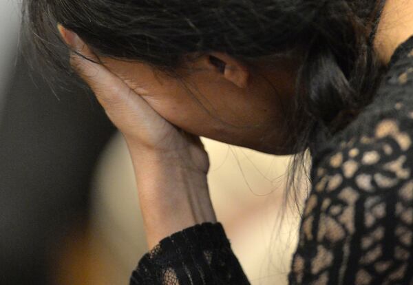 June 28, 2018 Lawrenceville - A family member of Silling Man becomes emotional during the preliminary hearing of Emmett Davis at Gwinnett County jail - Magistrate Court on Thursday, June 28, 2018. Emmett Davis was the boyfriend of Silling Man, the GSU student found dead in December in the back of a Subway in Gwinnett Place Mall. Davis is accused of killing Man by asphyxiation. HYOSUB SHIN / HSHIN@AJC.COM