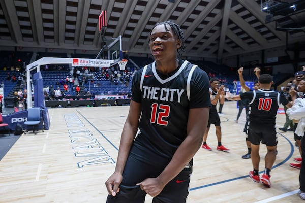 Tri-Cities forward Jalan Wingfield (12) reacts after their win against Woodward Academy in the GHSA Boys 5A State Championship at the Macon Centreplex, Friday, March, 7, 2025, in Macon, Ga. Tri-Cities won 66-55. (Jason Getz / AJC)