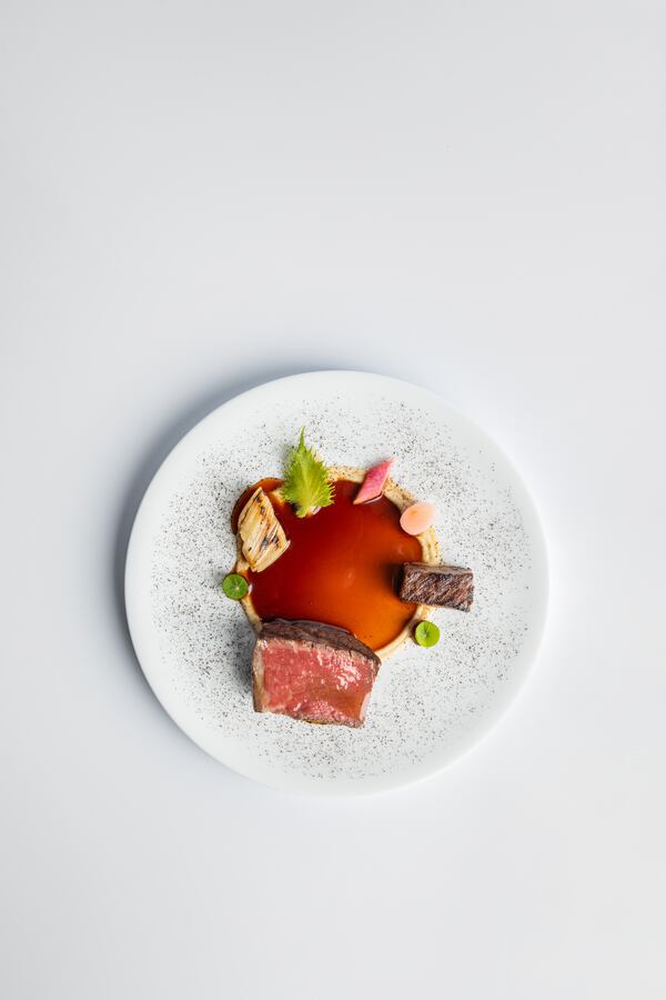 This dish of wagyu beef is served with assorted condiments at Atlas. Courtesy of Atlas