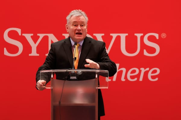 Roger Tutterow, Kennesaw State professor of economics, addresses his remarks during the annual Synovus Economic Forecast Breakfast event for insights into the economic environment at Cobb Energy Performing Arts Center on Feb. 26. (Miguel Martinez/AJC)