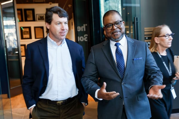 The Atlanta Journal-Constitution's Editor-in-Chief walks with Cox Enterprises CEO Alex Taylor before the ribbon-cutting ceremony at the Atlanta Journal-Constitution in Midtown on Friday, January 24. 2025.
(Miguel Martinez/ AJC)