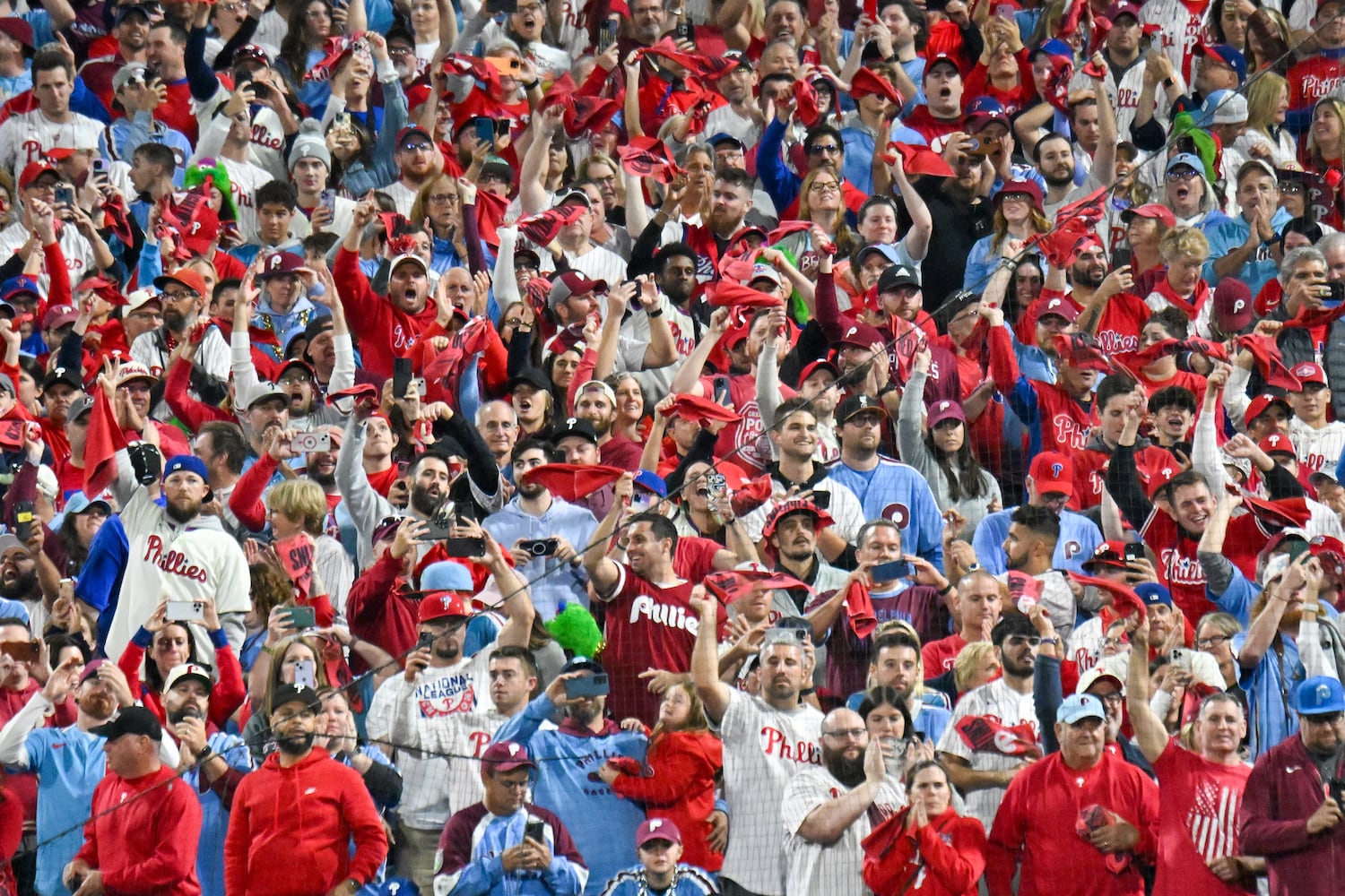 Philadelphia Phillies fans celebrate a 3-1 win and a division victory against the Atlanta Braves after the ninth inning of NLDS Game 4 at Citizens Bank Park in Philadelphia on Thursday, Oct. 12, 2023.   (Hyosub Shin / Hyosub.Shin@ajc.com)