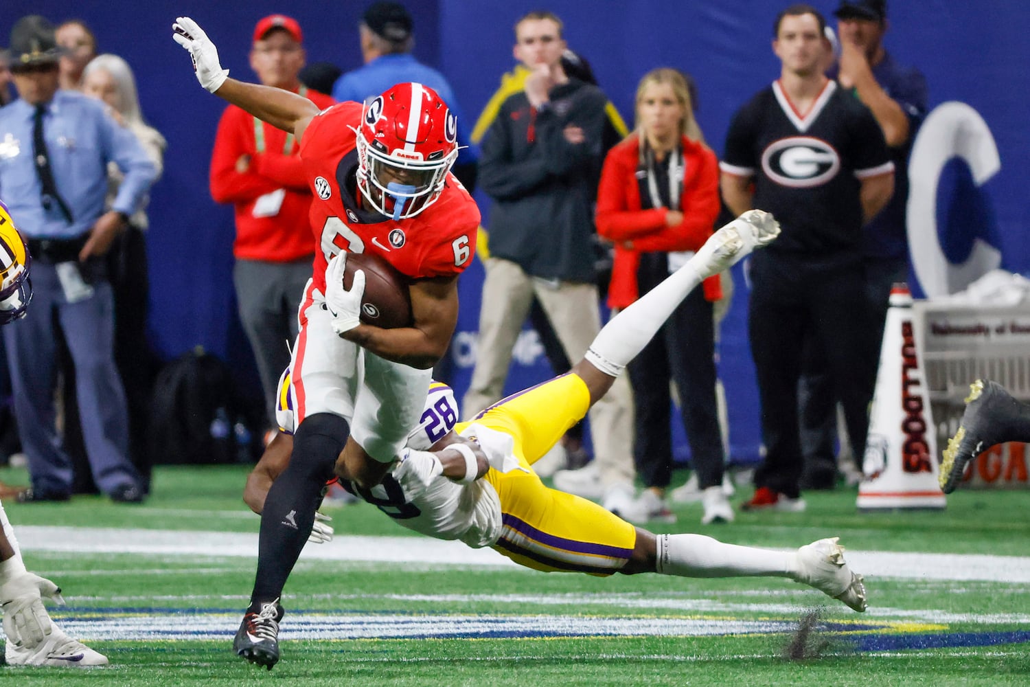 Georgia Bulldogs running back Kenny McIntosh (6) charges for a first down against the LSU Tigers during the second half of the SEC Championship Game at Mercedes-Benz Stadium in Atlanta on Saturday, Dec. 3, 2022. (Bob Andres / Bob Andres for the Atlanta Constitution)