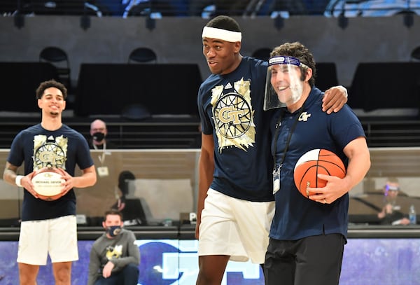 Georgia Tech's forward Moses Wright (left) embraces head coach Josh Pastner before their game against Syracuse Saturday, Feb. 27, 2021, at McCamish Pavilion in Atlanta. (Hyosub Shin / Hyosub.Shin@ajc.com)