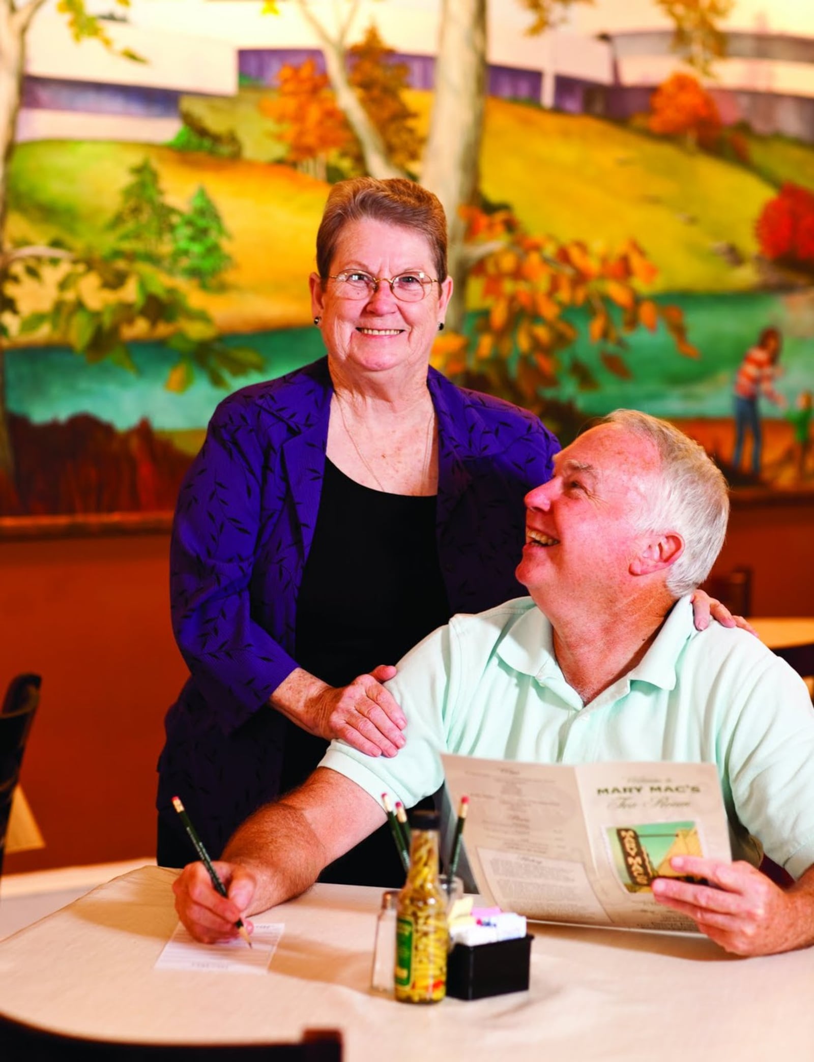 Jo Carter, who has been the Goodwill Ambassador at Mary Mac’s Tea Room since 2006, is shown with a patron in 2010. Carter, 78, is retiring — for real, this time. CONTRIBUTED BY DEBORAH WHITELAW LLEWELLYN