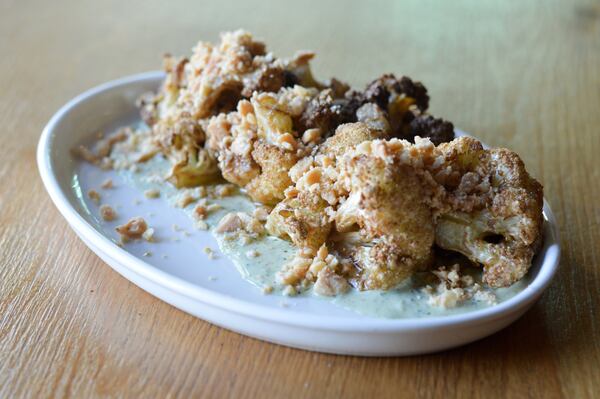 An appetizer of roasted cauliflower with spiced yogurt, bagna cauda and Marcona almonds at Double Zero. CONTRIBUTED BY HENRI HOLLIS