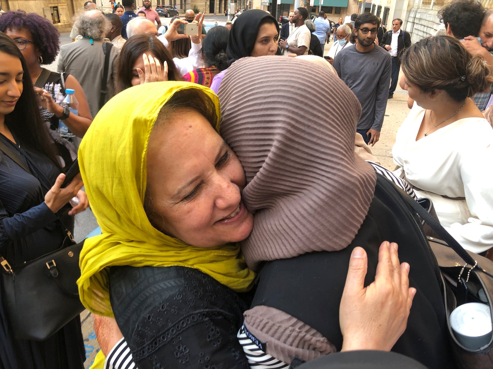 FILE - Shamim Syed, Adnan Syed's mother, left, celebrates with others outside the Cummings Courthouse, Sept. 19, 2022, in Baltimore after a judge ordered the release of her son, Adnan Syed, overturning his conviction for a 1999 murder that was chronicled in the hit podcast "Serial." (AP Photo/Brian Witte, File)