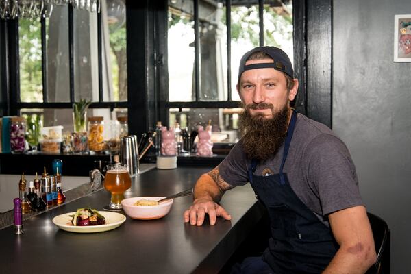 Chef Taylor Neary at the bar at Restaurant Holmes. Photo credit- Mia Yakel.