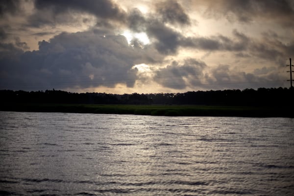 In this Monday, June 10, 2013 photo, the sun rises over Sapelo Island, Ga.