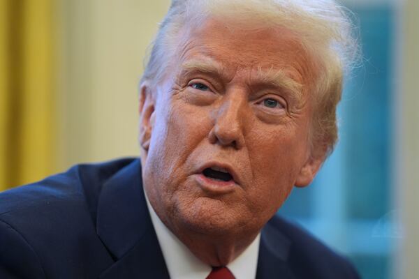 President Donald Trump speaks as he signs executive orders in the Oval Office at the White House, Thursday, Jan. 30, 2025, in Washington. (AP Photo/Evan Vucci)