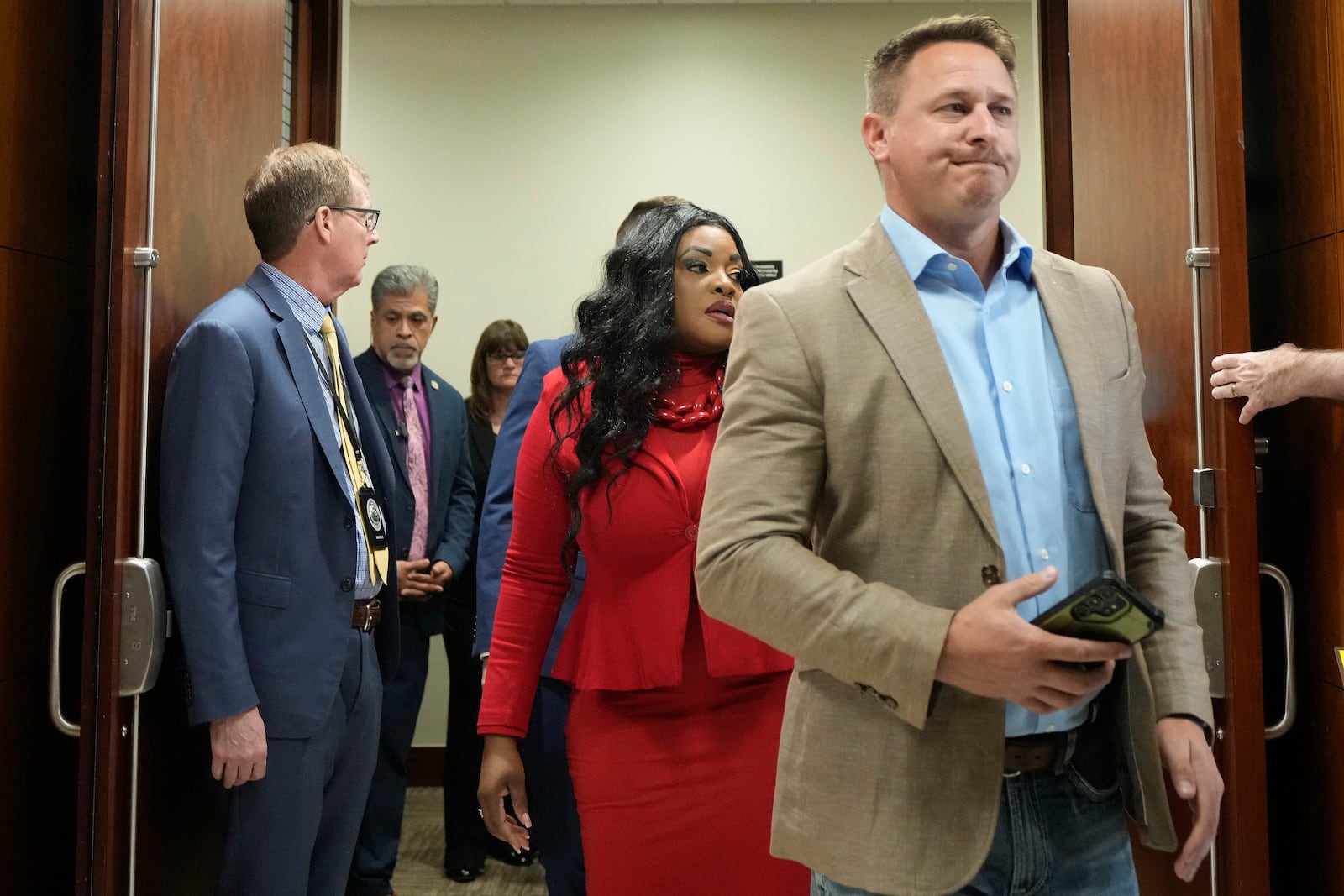 Ryan Tuttle, son of Dennis Tuttle, walks out of the courtroom after former Houston police officer Gerald Goines was sentenced to 60 years behind bars on a pair of felony murder convictions on Tuesday, Oct. 8, 2024, in Houston. Goines was found guilty of felony murder in the 2019 deaths of Dennis Tuttle and Rhogena Nicholas. (Brett Coomer/Houston Chronicle via AP)