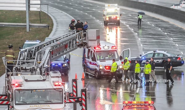 Alpharetta police worked a situation at the Haynes Bridge Road exit sign early Wednesday. Ga. 400 South reopened just before 8:40 a.m.