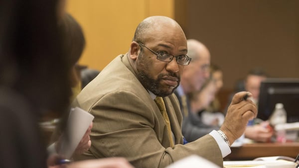 Lead prosecutor Clint Rucker speaks with other attorneys on his team during jury selection in the Tex McIver murder case. Alyssa Pointer / alyssa.pointer.ajc.com