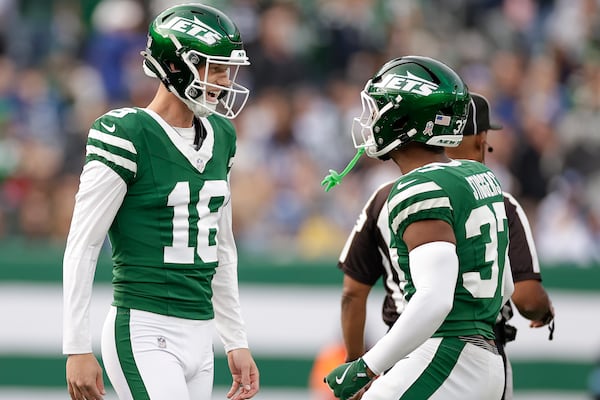 New York Jets place kicker Anders Carlson (18) celebrates with teammates after kicking a 58-yard field goal against the Indianapolis Colts during the third quarter of an NFL football game, Sunday, Nov. 17, 2024, in East Rutherford, N.J. (AP Photo/Adam Hunger)