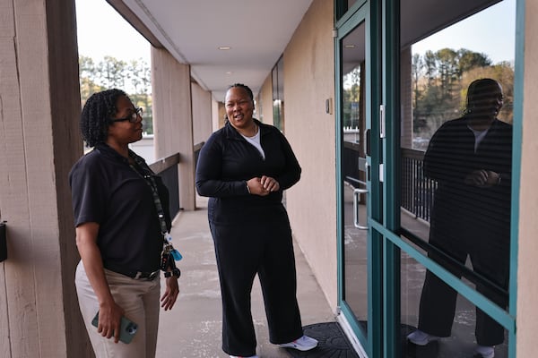 Rosalyn Martin (left) shares a laugh with her case worker, Ericka Sturdifen, at Mary Hall Freedom Village on Thursday, March 13, 2025. Martin is currently training to become a correctional officer after being homeless and recovering from addiction following the deaths of her father and brother. (Natrice Miller/AJC)