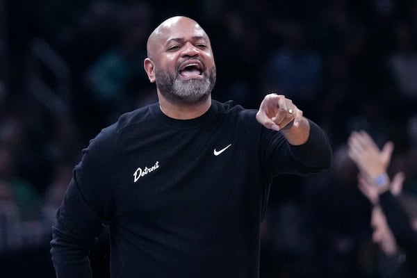 Detroit Pistons head coach J.B. Bickerstaff calls to his players during the first half of an NBA basketball game against the Boston Celtics, Wednesday, Dec. 4, 2024, in Boston. (AP Photo/Charles Krupa)