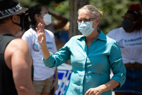  Carolyn Bourdeaux, Democratic nominee in Georgia's 7th Congressional District, talks with volunteers at her Suwanee headquarters Saturday, August 8, 2020. STEVE SCHAEFER FOR THE ATLANTA JOURNAL-CONSTITUTION