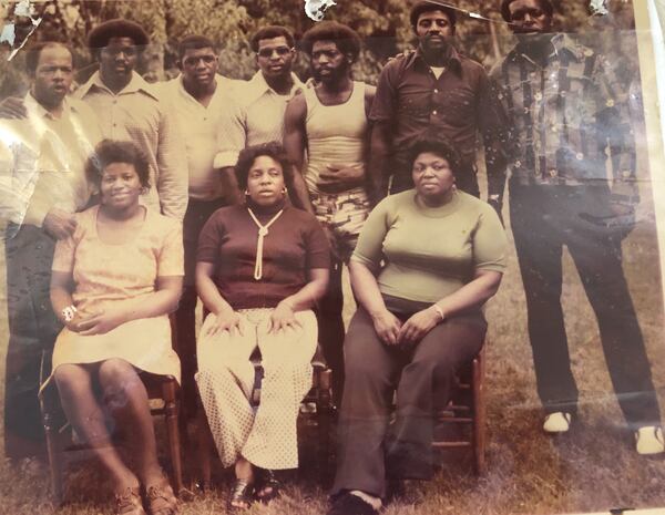 John Lewis, upper left and his nine brothers and sisters circa 1975. 
Front row L-R Rosa, Ethel, Ora
Back row L-R, John, Henry, William, Samuel, Freddie, Edward and Adolph