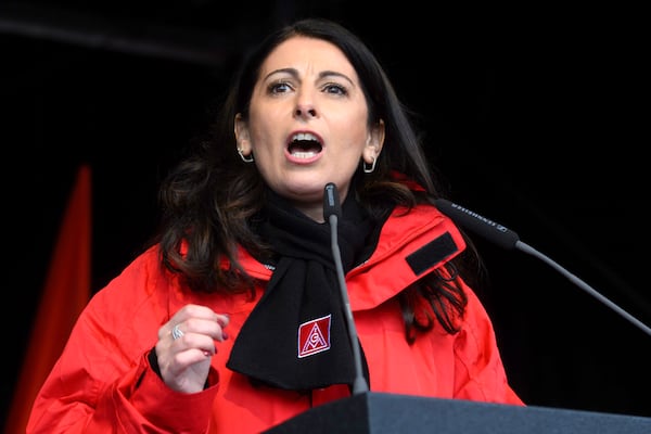 Daniela Cavallo, Chairwoman of the Volkswagen General Works Council, speaks at a rally during at nationwide warning Volkswagen workers' strike, on the grounds of the main Volkswagen plant in Wolfsburg, Germany, Monday, Dec. 2, 2024. (Julian Stratenschulte/dpa via AP)