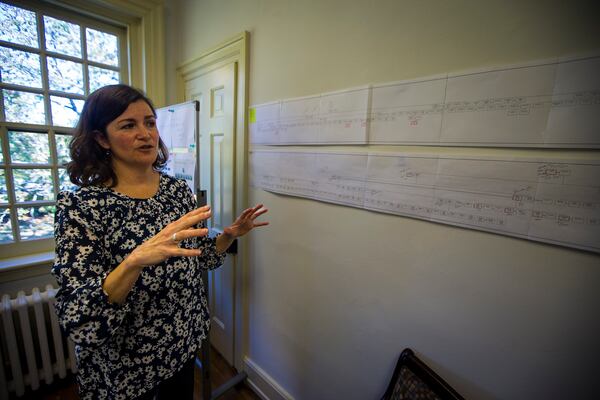 Elizabeth Drembus discusses the known family trees of some of the students that attended the Williamsburg Bray School on Wednesday, Oct 30, 2024 in Williamsburg, Va. (AP Photo/John C. Clark)