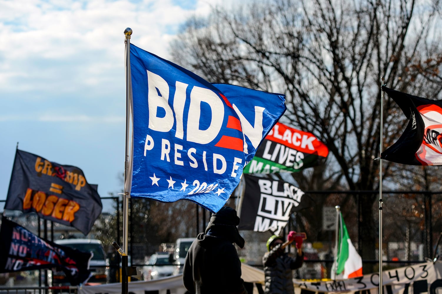 A flag flies in support of President-elect Joe Biden at Black Lives Matter Plaza in Washington on Inauguration Day, Wednesday, Jan. 20, 2021. (Kenny Holston/The New York Times)