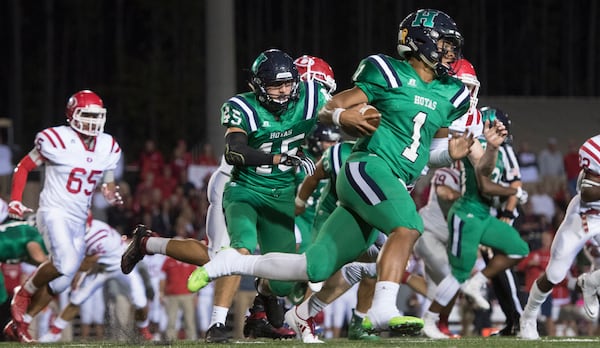 Harrison quarterback Justin Fields (1) runs against Dalton on Thursday, Oct. 19, 2017, in Kennesaw. (Special to the Atlanta Journal-Constitution, John Amis )