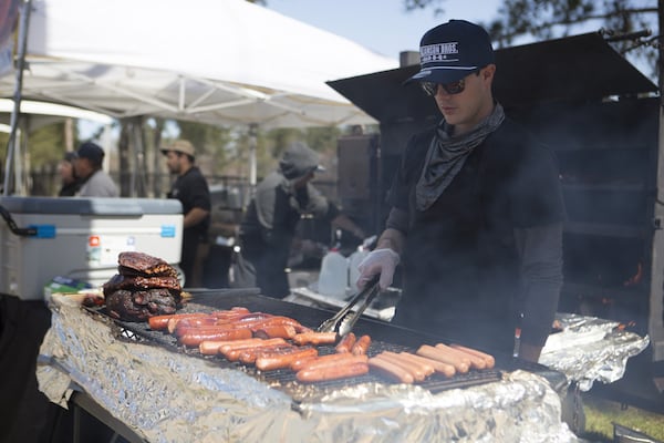 A pitmaster mans a grill during the Georgia Food and Wine Festival in Marietta. Courtesy of the Georgia Food and Wine Festival