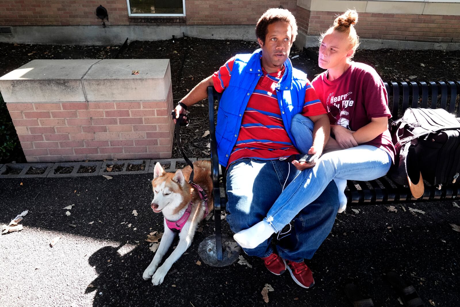 Brandon Taylor, 35, left, sits with his girlfriend Whitney Black, 35, while taking about the 2024 presidential election during an interview in Lewisville, Texas, Wednesday, Oct. 2, 2024. (AP Photo/LM Otero)